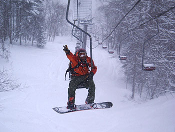 John Matkovic in a snow storm on the Link Chairlift, Furano, March 2006